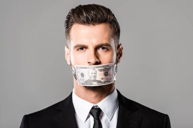 businessman with dollar banknote on mouth isolated on grey clipart