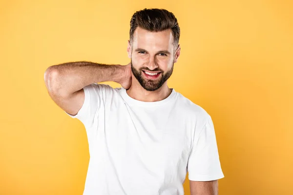 Happy Handsome Man White Shirt Touching Neck Isolated Yellow — Stock Photo, Image