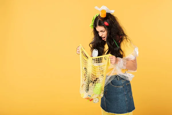 Shocked Girl Trash Hair Holding Bag Rubbish Isolated Yellow — Stock Photo, Image