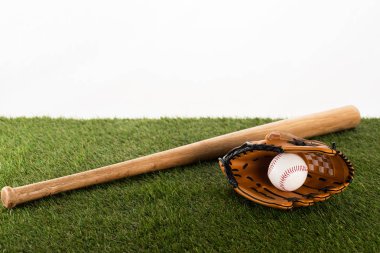 baseball bat, glove and ball on green grass isolated on white, sports betting concept clipart