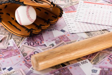 betting lists near baseball bat, glove and ball on euro and dollar banknotes, sports betting concept clipart