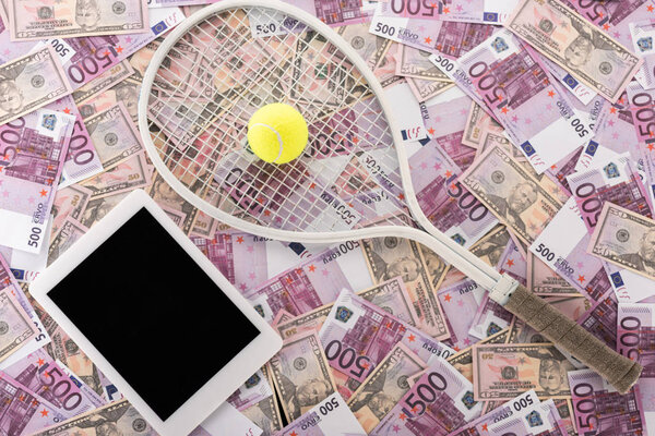 top view of digital tablet with blank screen, tennis racket and ball on euro and dollar banknotes, sports betting concept