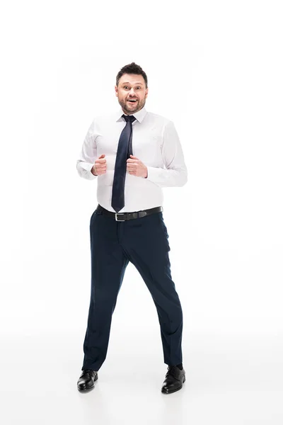 Chubby man in formal wear looking at camera and smiling on white — Stock Photo