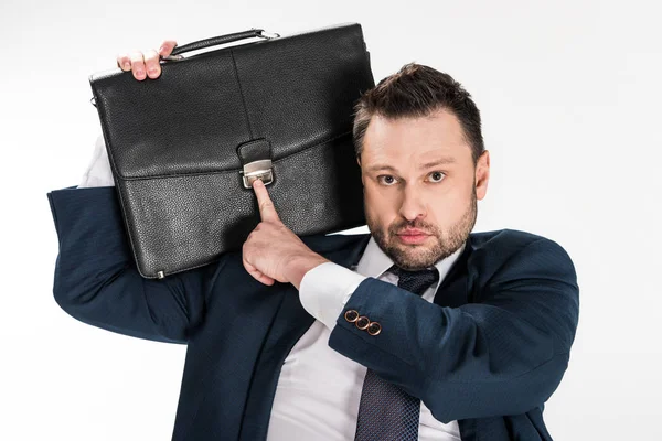 Chubby businessman holding briefcase and looking at camera isolated on white — Stock Photo