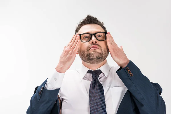 Chubby man in formal wear putting on glasses on white — Stock Photo