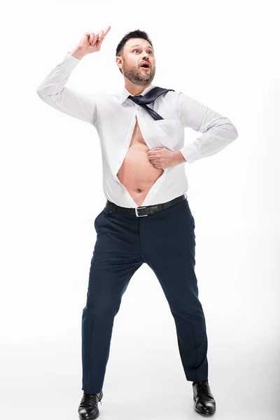 Excited overweight man in tight formal wear pointing with finger isolated on white — Stock Photo