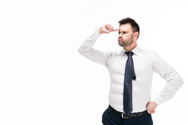 Overweight man in tight formal wear pointing with finger at forehead isolated on white with copy space — Stock Photo