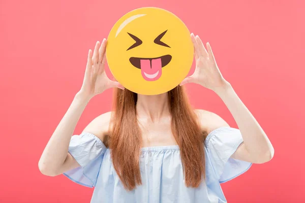 KYIV, UKRAINE - MAY 23, 2019: front view of redhead girl holding laughing smiley isolated on pink — Stock Photo