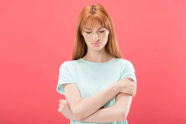 Front view of pensive redhead young woman looking down isolated on pink — Stock Photo