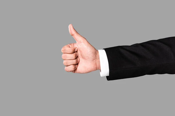 Обрізаний вид бізнесмена, що показує великий палець вгору ізольовано на сірому — Stock Photo