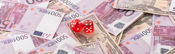 Panoramic shot of dice on euro and dollar banknotes, sports betting concept — Stock Photo