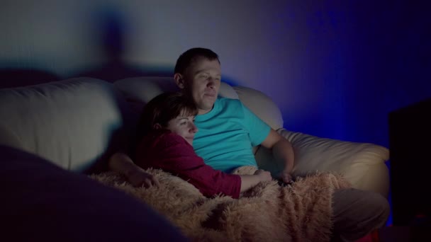 Married Couple Sitting Embracing Late Night Watching — Stock Video