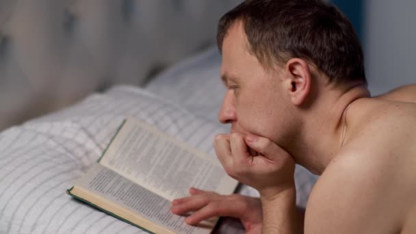 Man Reads Book Bedtime Lying Bed — Stock Video