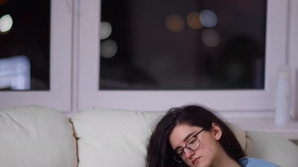 Cute Brunette Girl Glasses Reads Book Her Head Couch Camera — Stock Video