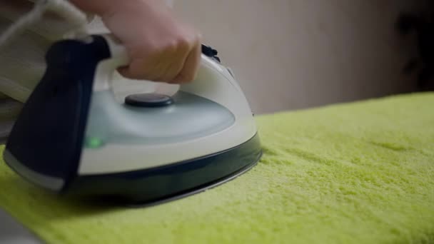 Woman housewife ironing soft terry towel, rack focus, close-up — Stock Footage Woman housewife ironing soft terry towel, rack focus, close-up Royalty Free Stock Video