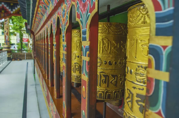 Bhutanese prayer wheels or Mani wheels, made of copper with the — Zdjęcie stockowe