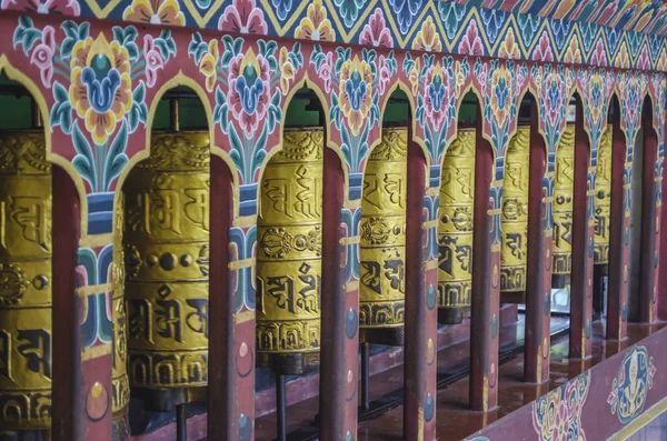 Bhutanese prayer wheels or Mani wheels, made of copper with the — 图库照片