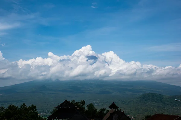 stock image A scenic landscape view of cloud movement during the day with blue sky and mountain from horizon in Bali, Indonesia