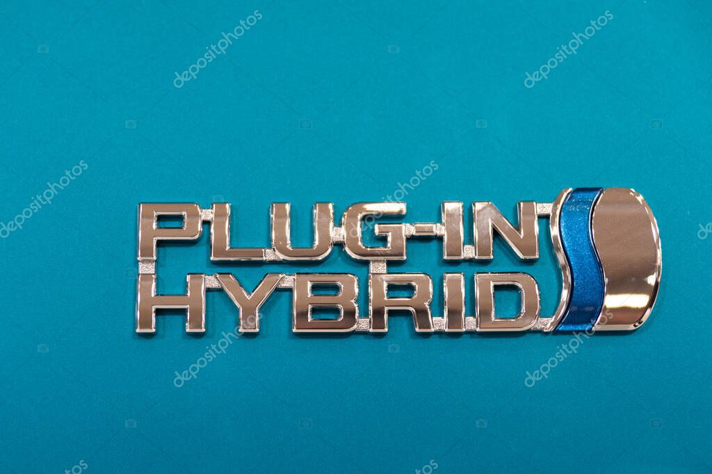 Odaiba, Tokyo, Japan - January 2, 2020: Toyota City Showcase Mega Web Palette Town. PLUG-IN HYBRID logo in close-up.