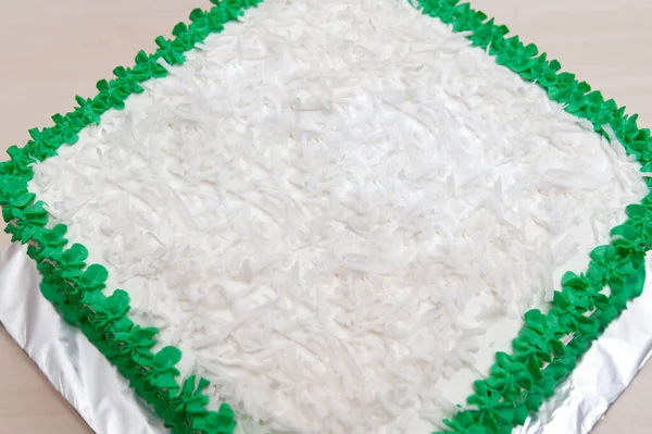 Birthday Cake Decorated Green Icing Grated Coconut Isolated Wooden Table — Stock Photo, Image