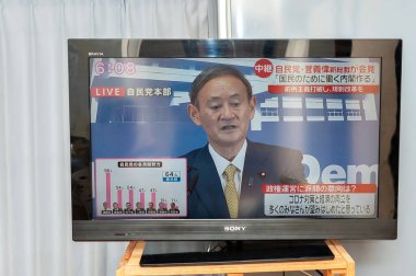 Fuji City, Shizuoka, Japan - September 14, 2020: Press conference broadcast live on Japanese television by Yoshihide Suga, the new prime minister of Japan. clipart