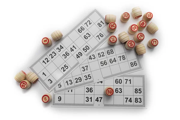 Bingo or lotto game. Wooden kegs of lotto on cards.