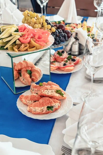 Catering service. Catering food. Table with food at event. Beautifully decorated catering banquet table with different food snacks and appetizers with sandwich.