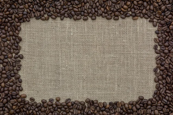 coffee beans frame border with copy space in the burlap