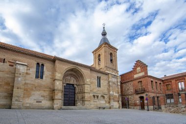 Benavente, Zamora, Spain, June 2017:  view of the Church of  the San Juan de el Mercado in the historic centre of the town of Benavente clipart