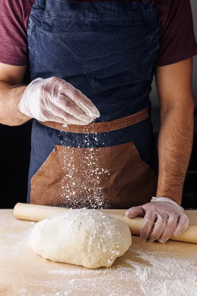 making dough flour man hand