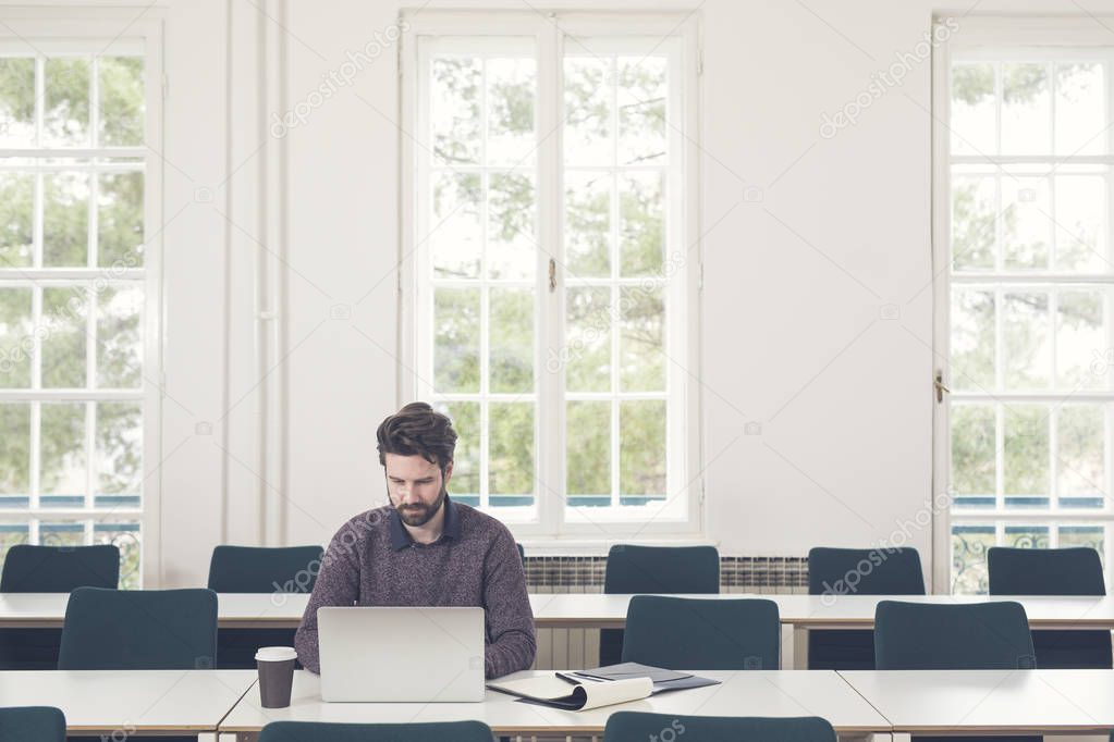 Young Businessman Working on Laptop