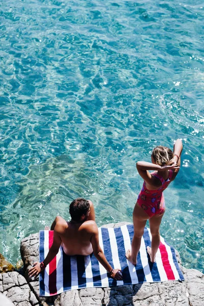 Boyfriend Girlfriend Sitting Rock Sea Sunbathing Royalty Free Stock Images