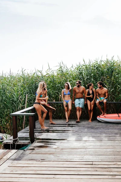 Group Smiling People Swimwear Standing Deck Enjoying Summertime Together — Stock Photo, Image