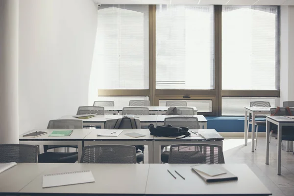 Furniture in empty high school classroom.