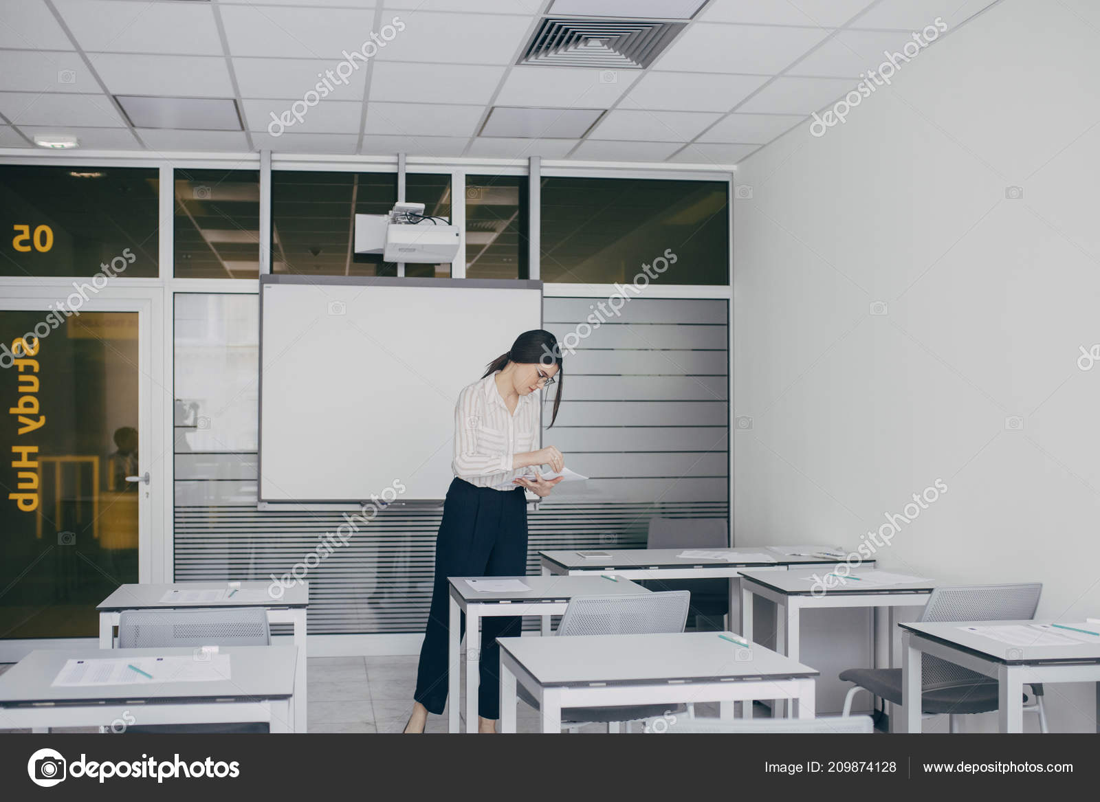 Teacher Giving Putting Exam Paper Classroom Table Stock