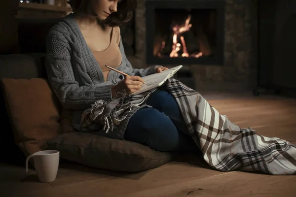 Beautiful Woman Sitting Fireplace Cozy Sweater Writing Notebook — Stock Photo, Image