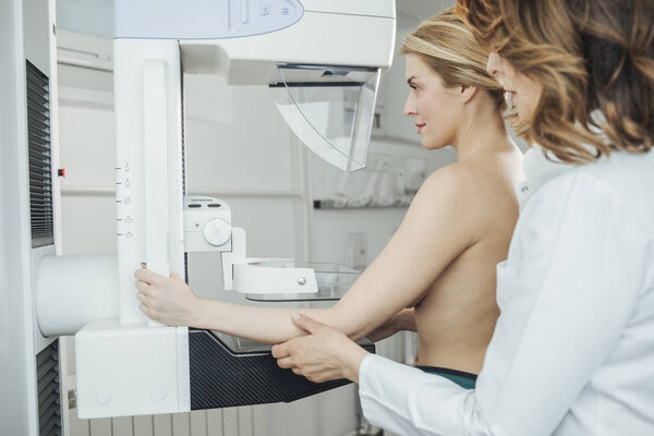 A woman having mammography examination at hospital.