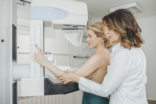 A woman having mammography examination at hospital.