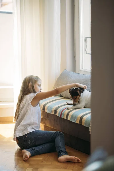 Pretty Blonde Girl Cuddling Her Dog Pet Home — Stock Photo, Image