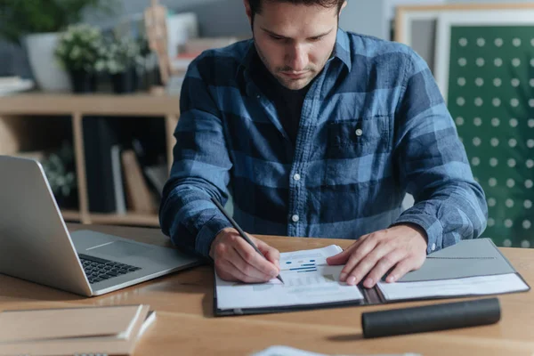 Handsome Young Caucasian Businessman Examining His Notes Graphs Modern Office — Stock Photo, Image