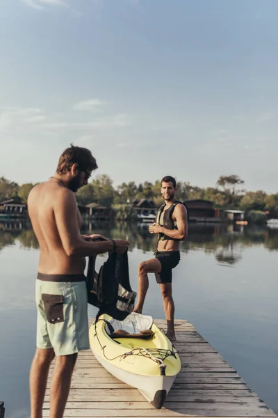 Two Men Wearing Life Vest While Standing Wooden Pier — ストック写真