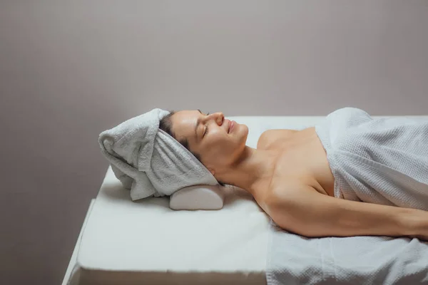 Woman Lying on a Massage Table — Stock Photo, Image