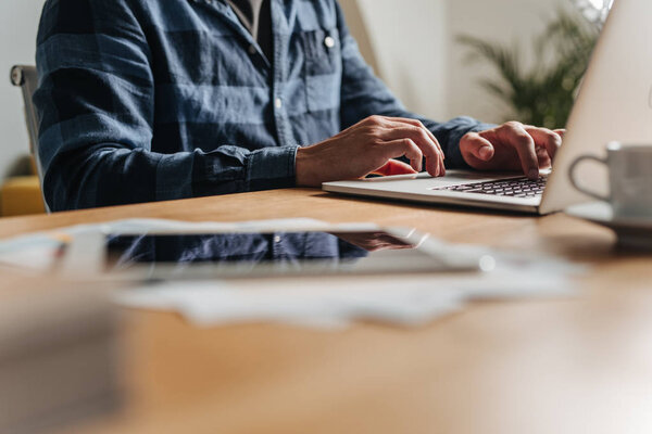 Businessman Typing on His Laptop