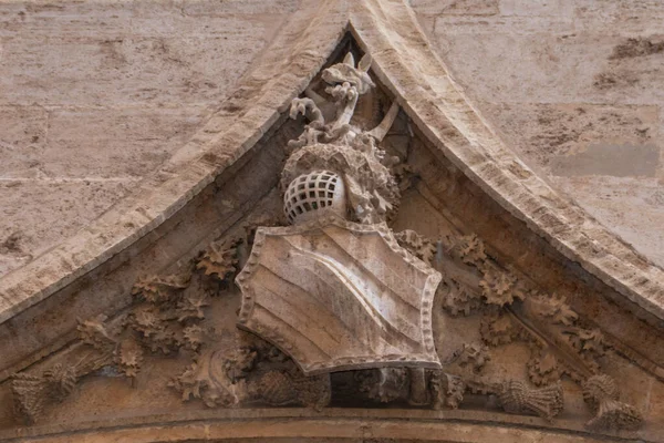 VALENCIA, SPAIN - JULY 15, 2020: Gothic gargoyle bas relief on an ancient historical building in Valencia — Stock Photo, Image