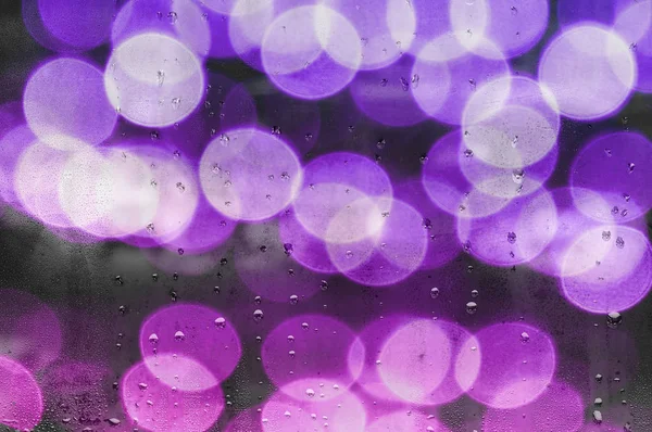 Water droplets on glass with blurred boke in background — Stock Photo, Image