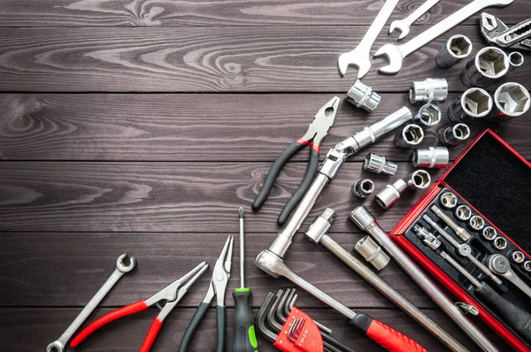 Set of auto tools on dark wooden workbench. copy space — Stock Photo, Image