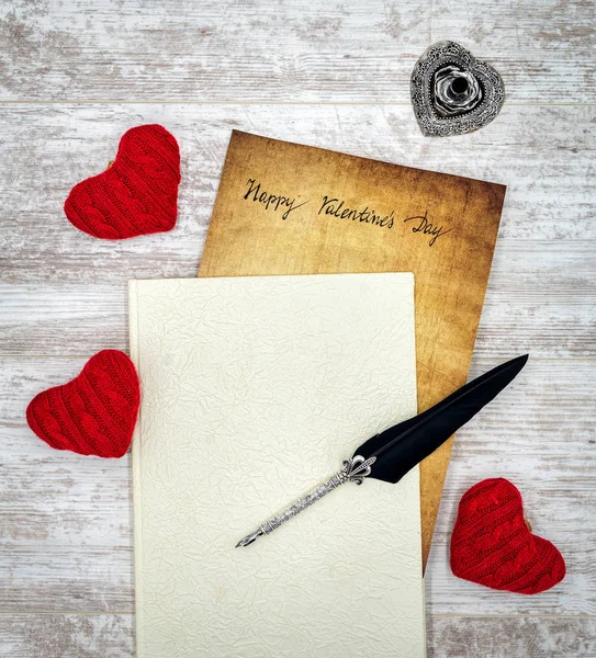 Happy Valentines Day card with love harts, book and quill