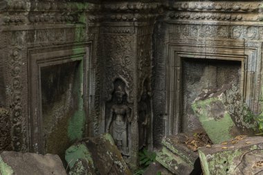 Apsara carving in a temple stone wall in Angkor Wat  clipart