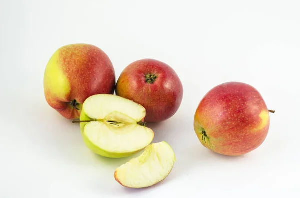 Apples on a white background, juicy red fruits. Useful fruit for a healthy diet.