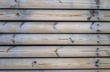 Kurullarının ahşap arka plan. Yatay panoları renk meşe ağartılmış. Yatay çit şeritler demir çivi ile.